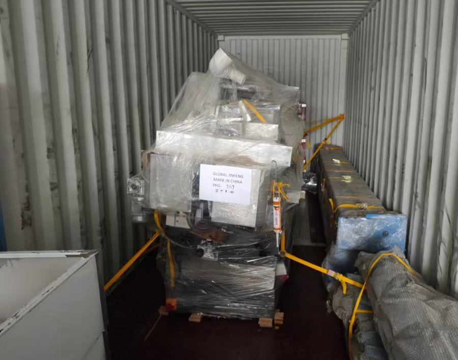Machines crated and strapped inside the container